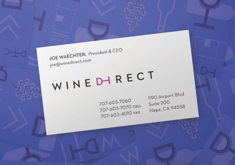 Wine Direct business card with President & CEO Joe Waechter's contact information on a purple backdrop of brand icons.